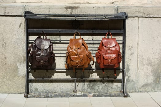 Collection of different stylish backpacks. Street photo.