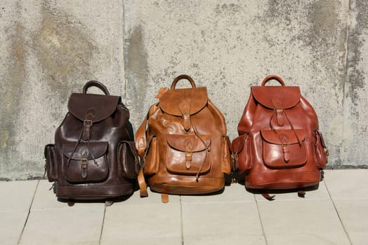 Collection of different stylish backpacks. Street photo.