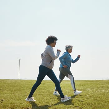 Women speed walking, fitness and cardio outdoor with training and energy with mockup space. Female people, team in park with exercise and race with sports and athlete, health and wellness in nature.