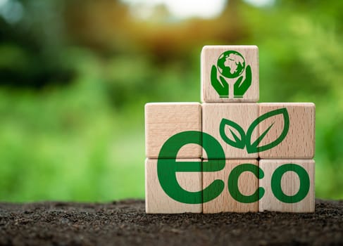 Wooden sticks stacked with ECO concept lettering on nature background. concept of future business growth for the environment. and design for reuse and renewable material resources and a sustainable environment