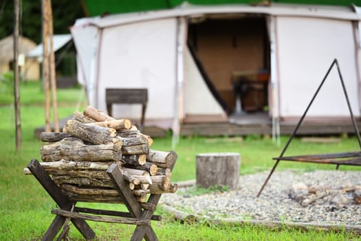 Pile of firewood in campsite, tourism, recreation outside, camping and travel concept.