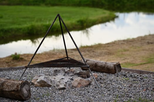 Pile of firewood in campsite, tourism, recreation outside, camping and travel concept.