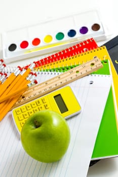 Variety of school supplies on a white background.