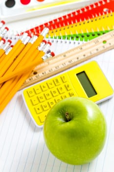 Variety of school supplies on a white background.