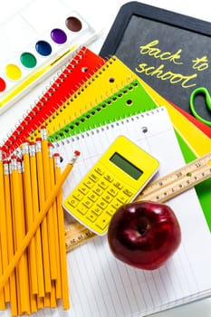 Variety of school supplies on a white background.