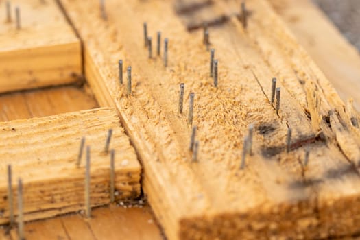 Rustic Background broken crate with nails sticking out of it . High quality photo