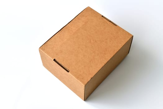 Closed cardboard box isolated on a white background