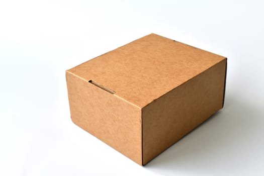 Closed cardboard box isolated on a white background