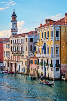 VENICE, ITALY - JUNE 27, 2018: Grand Canal with boats and gondolas on sunset, Venice, Italy