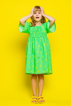 Scared fearful young blonde child girl kid terrified about danger problems, suffering phobia, anxiety disorder, expresses fear, insecure, stress, panic. Preteen children on yellow background. Vertical