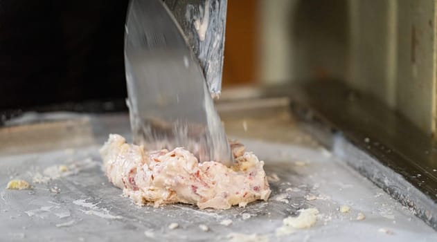 Preparing unique and tasty ice cream on a hot plate by blending different flavors and textures.