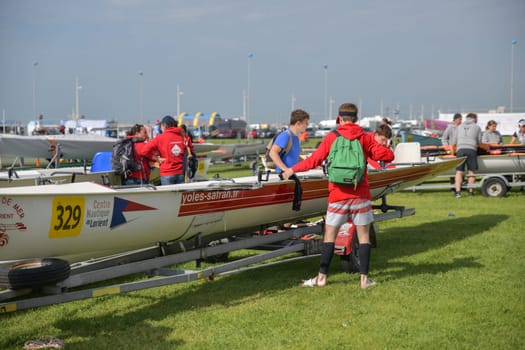 DIEPPE, FRANCE - MAY 25, 2019: French Rowing Championship. Water Rowing boats on the grass.