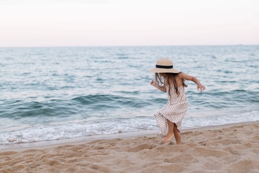 Little girl enjoying summer vacation at the sea.