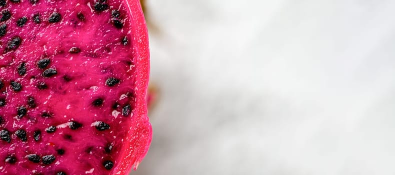 Ripe red dragon fruit on an isolated white background