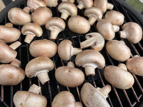 Raw champignon mushroom in bbq grill homemade juicy. High quality photo