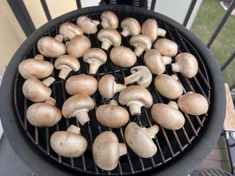 Raw champignon mushroom in bbq grill homemade juicy. High quality photo
