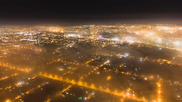 light bokeh city landscape at night sky with many stars, blurred city by fog covered download photo