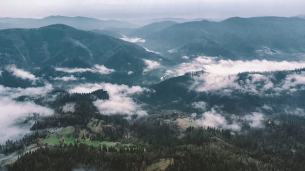 Landscape with mountains, low clouds and forest at the sun rise download photo