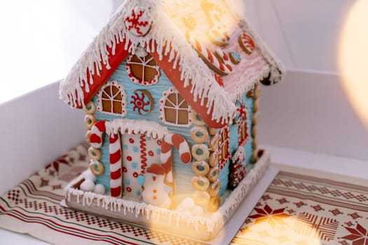 The hand-made eatable gingerbread house and snow decoration.