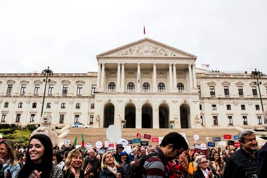 Lisbon, Portugal- May 24, 2018: Demonstrators protesting with placards against euthanasia and asking for palliative care at the doors of the Assembly of the Republic in Lisbon, Portugal