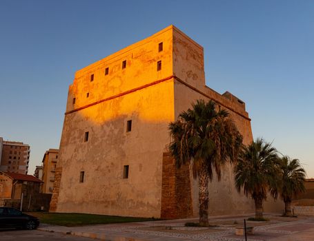 View of the Fortress also called Tower of Charles V at sunset in Porto Empedocle. Sicily