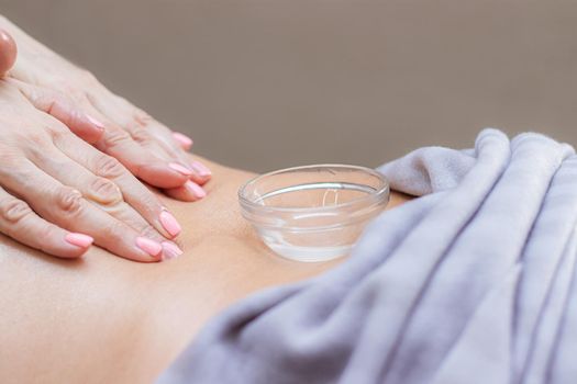 beautiful women's hands do massage . master's hand. unrecognizable model . massage room. spa procedures. light on the photo. article and advertising about massage and its benefits. the concept of beauty shooting . woman
