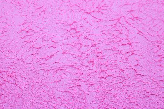 Pink background texture of putty . Decorative wall decoration. Pink wall. Texture with your own hands. Copy Space