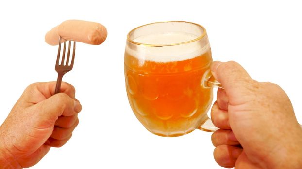 sausage on a fork and a mug of beer in male hands, isolate on a white background