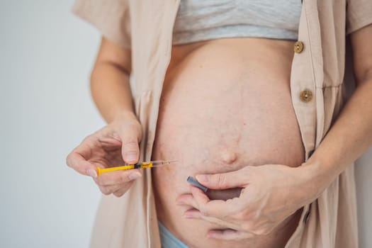 Mexico, Playa del Carmen 3.08.2023: Woman injects a dose of heparin Clexane into her belly.