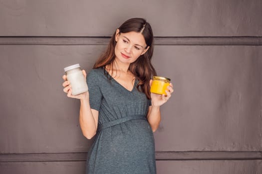 A glowing pregnant woman over 40, savoring nourishing ghee and coconut oil for a healthy and vibrant pregnancy journey.