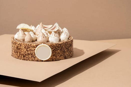 A scrumptious desert plate featuring a meringue desert, served on a cardboard plate and topped with cream