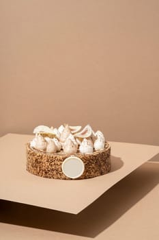 A scrumptious desert plate featuring a meringue desert, served on a cardboard plate and topped with cream