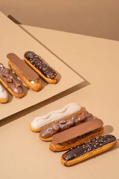 A set of delicious glazed donuts in a variety of flavors, arranged on a cardboard paper in an inviting display