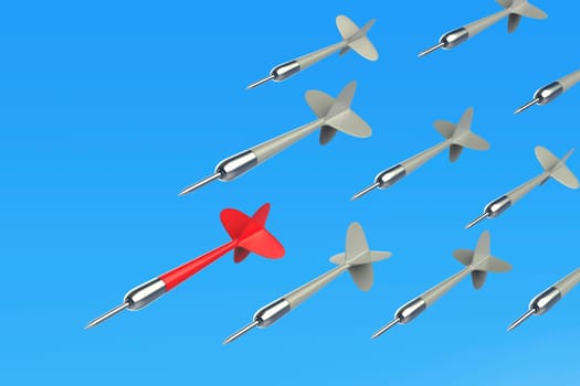 Concept image with many flying darts against blue sky, red dart on the front