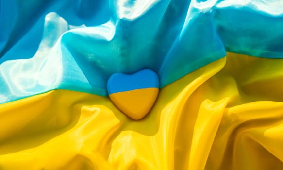 Flag of Ukraine heart beautiful background. Selective focus. Nature.