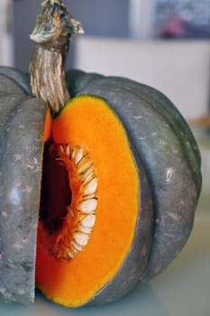 Cut the organic pumpkin into slices with a knife