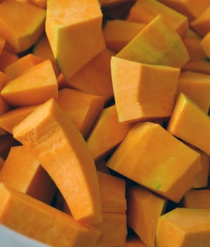 slice the organic pumpkin with a knife, shred the pumpkin for dessert,