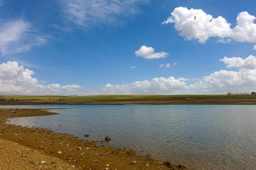 the arrival of spring and the awakening nature landscape-lake and clouds