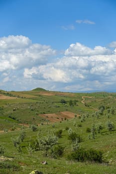 cloudy sky and green landscape, wonderful spring views, green field and hill plateau view,