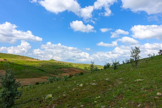 cloudy sky and green landscape, wonderful spring views, green field and hill plateau view,