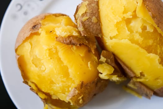 close-up of boiled whole potatoes in the plate,boiled large potatoes with the peel,