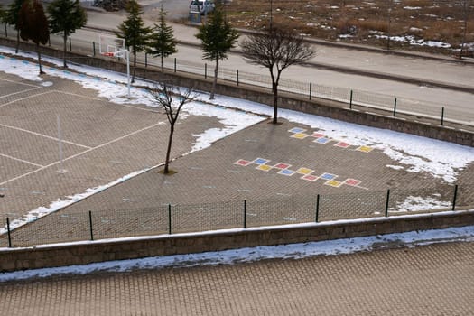 game figures drawn on the floor in a schoolyard,