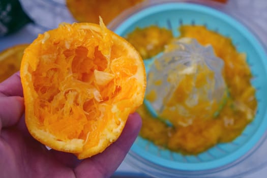 manual orange juice squeezing, squeezed oranges, orange juice squeezing at home,
