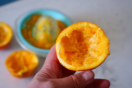 manual orange juice squeezing, squeezed oranges, orange juice squeezing at home,
