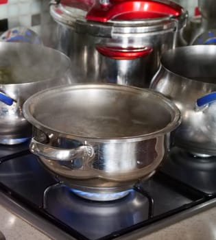 dishes cooked in a pot on the gas stove,