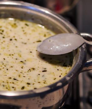 Boiling yoghurt soup on a freshly cooked stove, very hot yoghurt soup, highland soup,