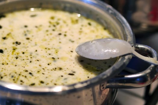 Boiling yoghurt soup on a freshly cooked stove, very hot yoghurt soup, highland soup,