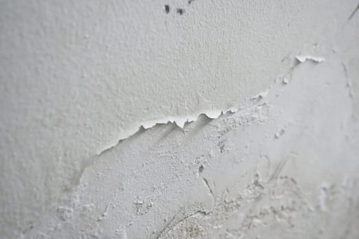 Paint swelling on the wall due to moisture, damp wall samples, damp wall and damage to the paint,