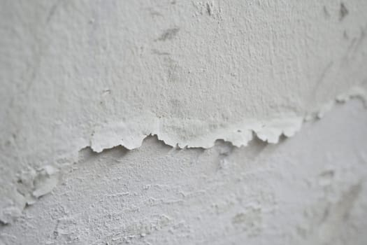 Paint swelling on the wall due to moisture, damp wall samples, damp wall and damage to the paint,