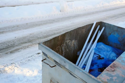 trash can on the street and defective fluorescent lamp wastes, trash cans and metal wastes,